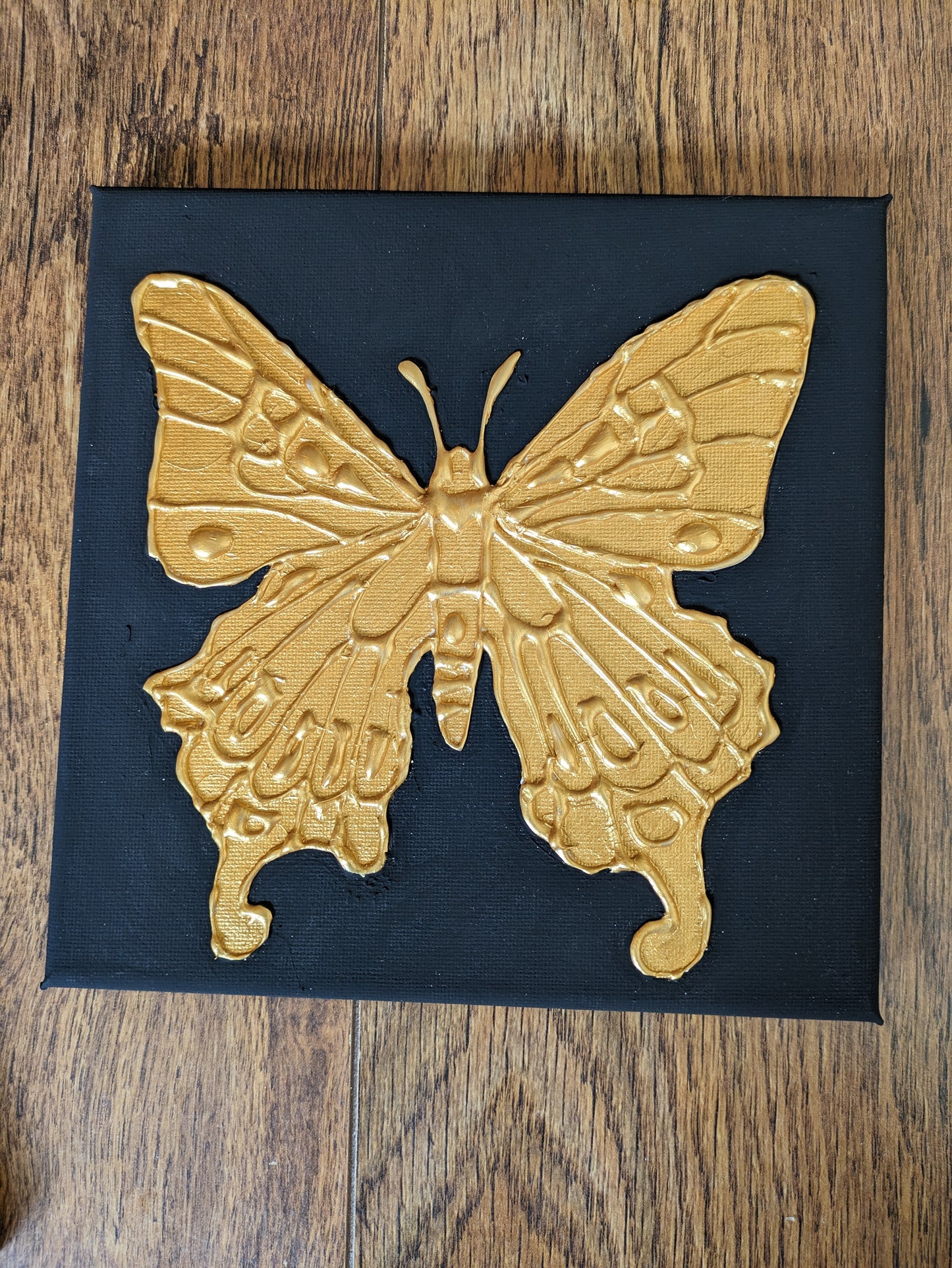 Set of three golden bug canvases