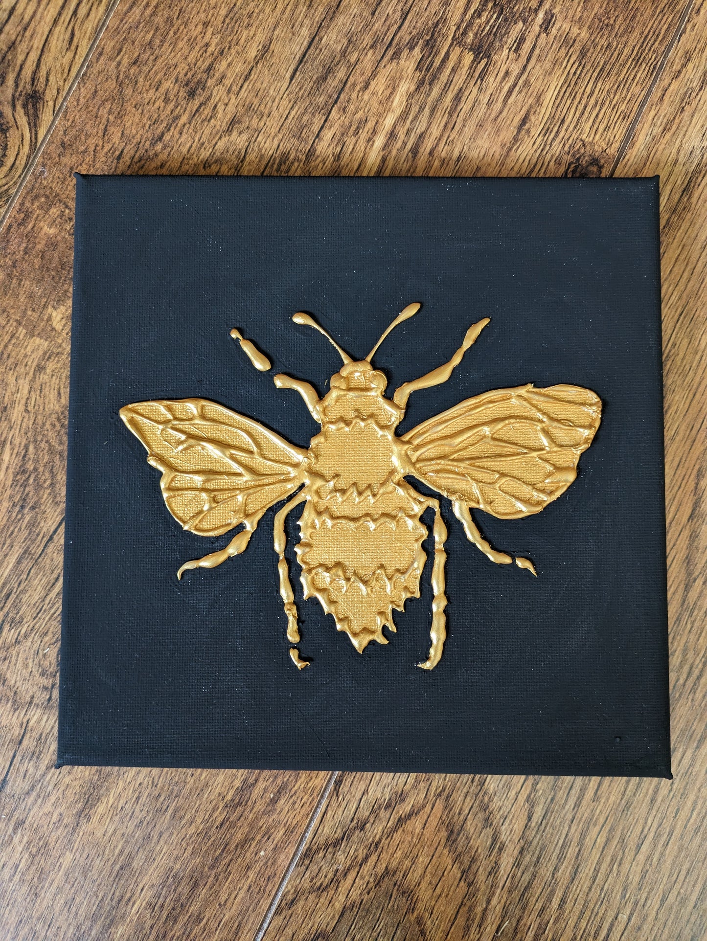 Set of three golden bug canvases